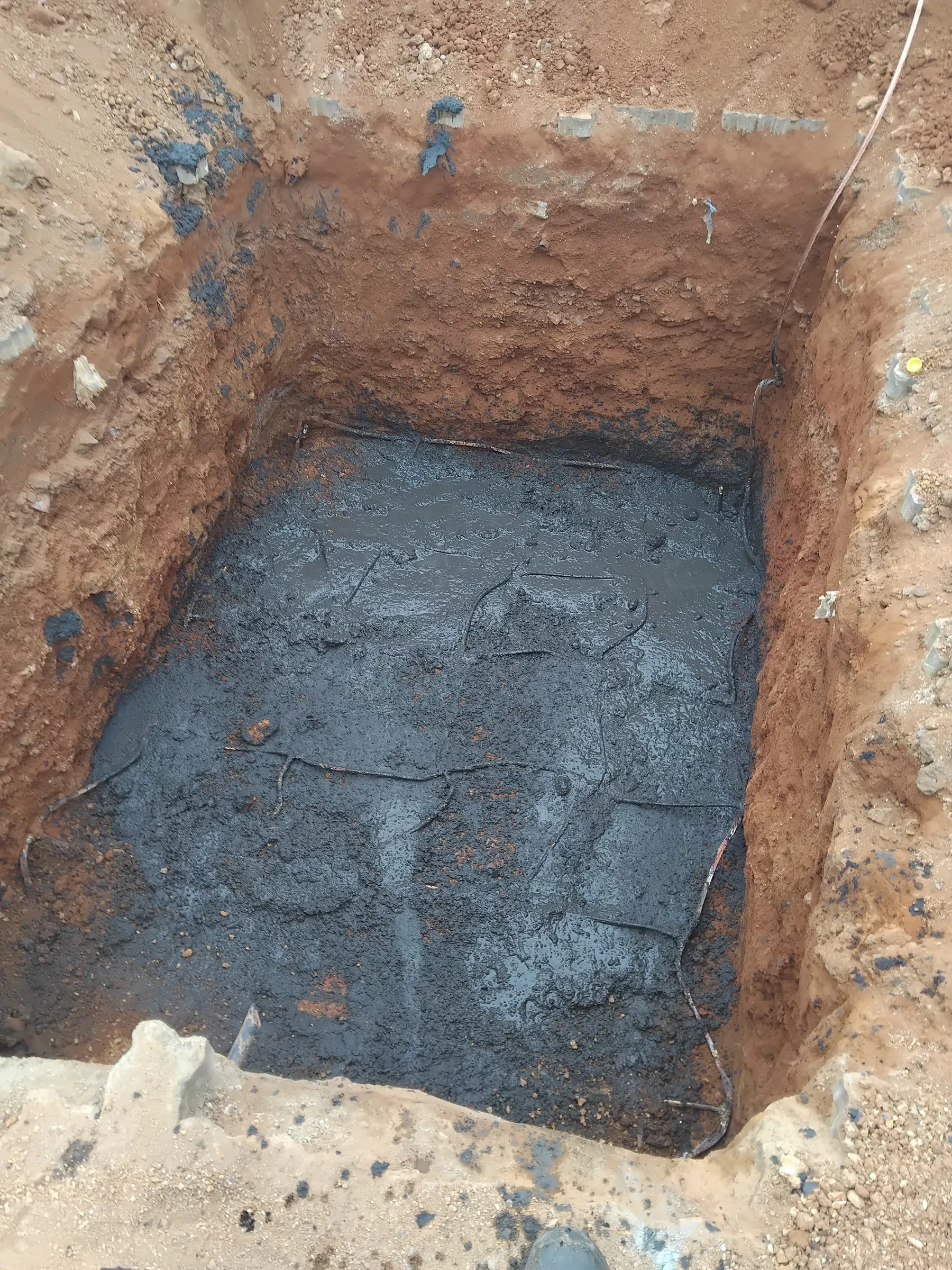 Earth-enhancing compound applied to lower soil resistivity and improve earthing.
